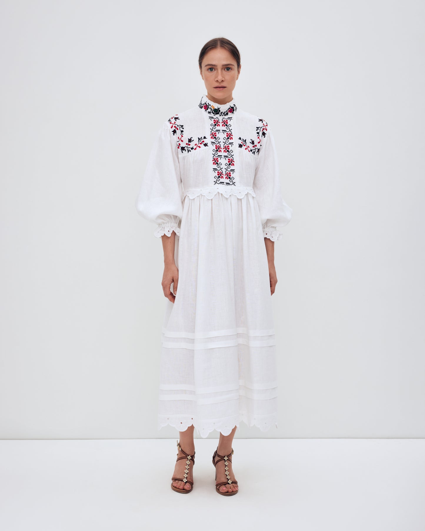 Купіть виріб ручної роботи Long embroidered dress with a high neck "Korolivna" від Nadiia World. Ідеальний вибір для додавання вишуканості та шарму до вашого житлового простору або колекції особистих аксесуарів.