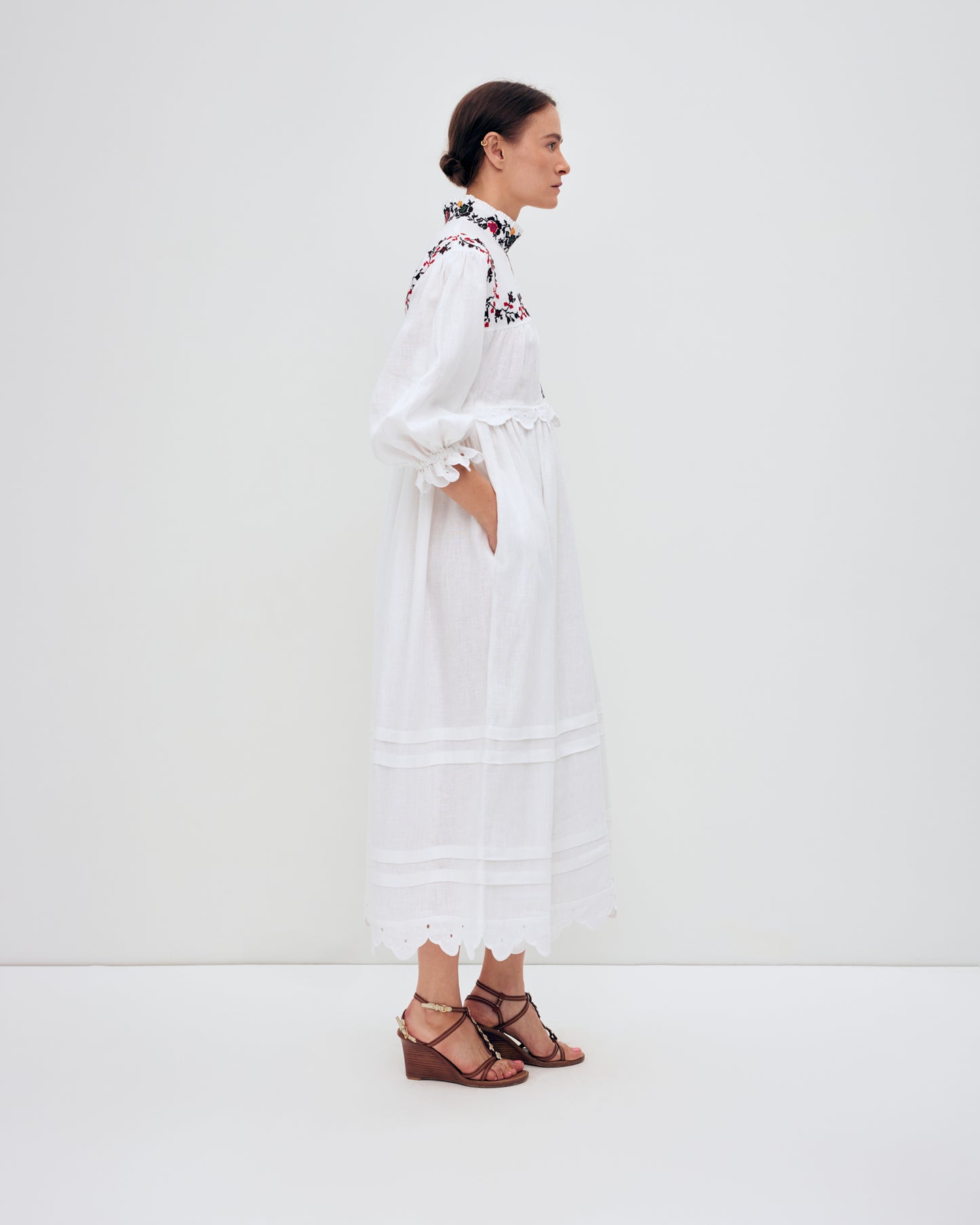 Купіть виріб ручної роботи Long embroidered dress with a high neck "Korolivna" від Nadiia World. Ідеальний вибір для додавання вишуканості та шарму до вашого житлового простору або колекції особистих аксесуарів.