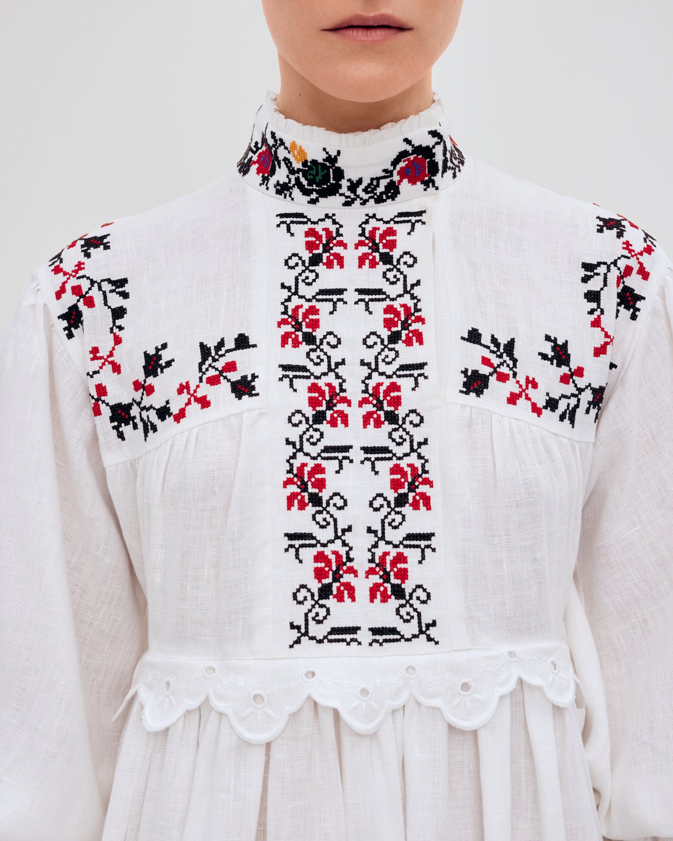 Купіть виріб ручної роботи Long embroidered dress with a high neck "Korolivna" від Nadiia World. Ідеальний вибір для додавання вишуканості та шарму до вашого житлового простору або колекції особистих аксесуарів.