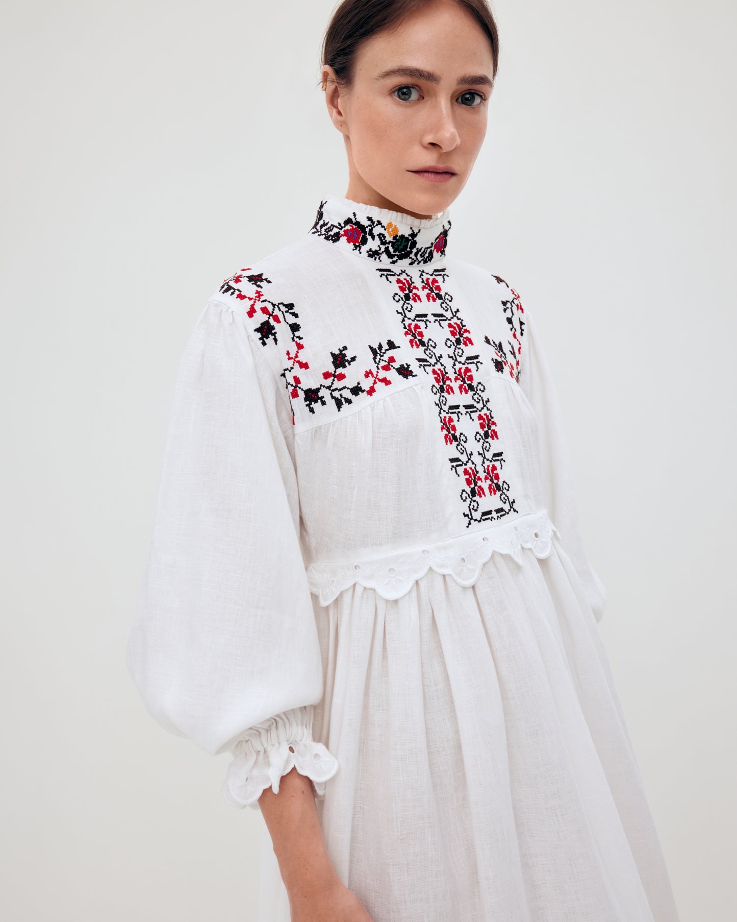 Купіть виріб ручної роботи Long embroidered dress with a high neck "Korolivna" від Nadiia World. Ідеальний вибір для додавання вишуканості та шарму до вашого житлового простору або колекції особистих аксесуарів.