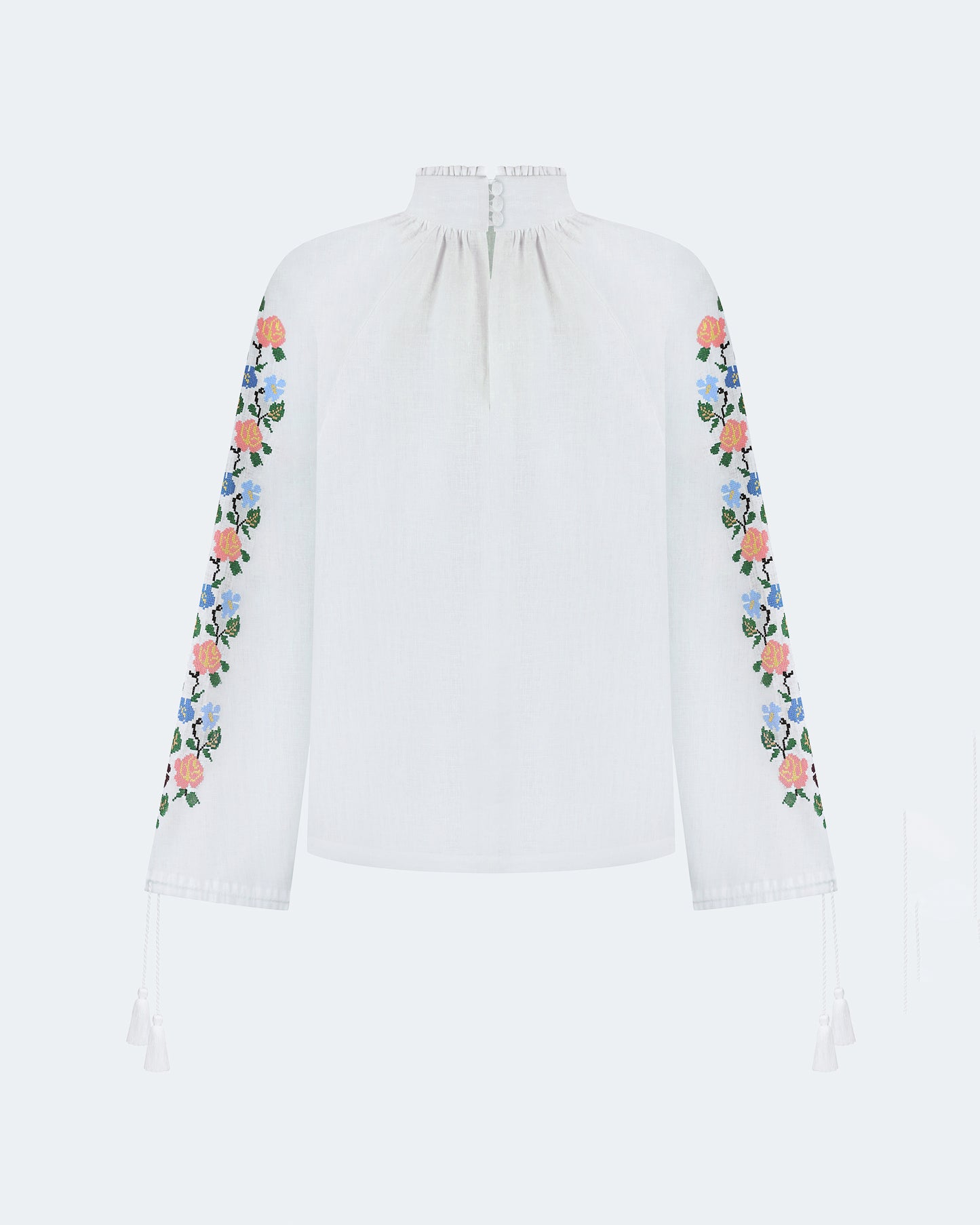 Купіть виріб ручної роботи Embroidered shirt "Bouquet" від Nadiia World. Ідеальний вибір для додавання вишуканості та шарму до вашого житлового простору або колекції особистих аксесуарів.