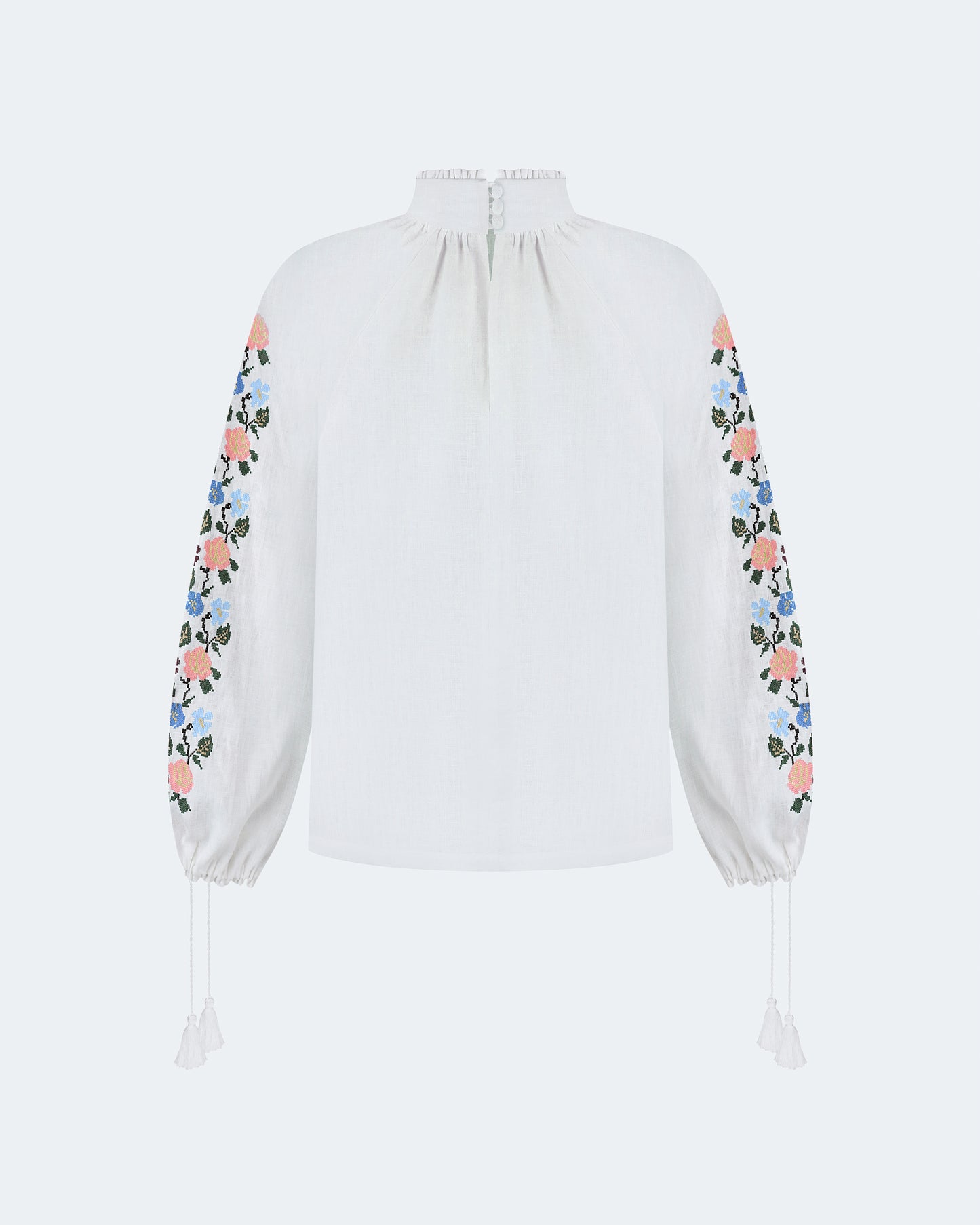 Купіть виріб ручної роботи Embroidered shirt "Bouquet" від Nadiia World. Ідеальний вибір для додавання вишуканості та шарму до вашого житлового простору або колекції особистих аксесуарів.