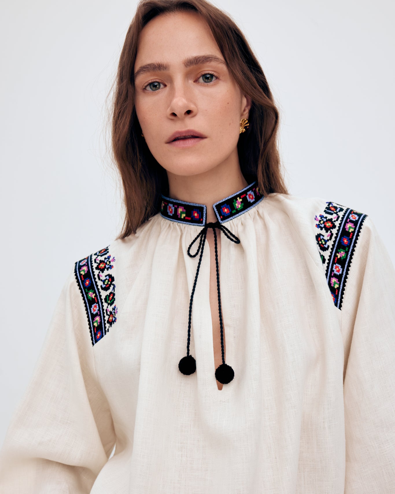 Купіть виріб ручної роботи Women's embroidered shirt "Olga" від Nadiia World. Ідеальний вибір для додавання вишуканості та шарму до вашого житлового простору або колекції особистих аксесуарів.