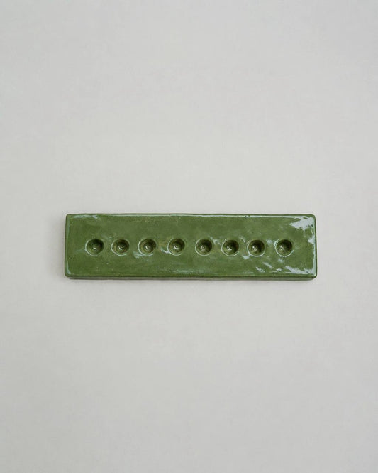 An Eight-Arm Candle Holder in Green