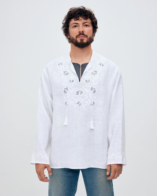 Купіть виріб ручної роботи Embroidered shirt Babylon XX in White від Nadiia World. Ідеальний вибір для додавання вишуканості та шарму до вашого житлового простору або колекції особистих аксесуарів.