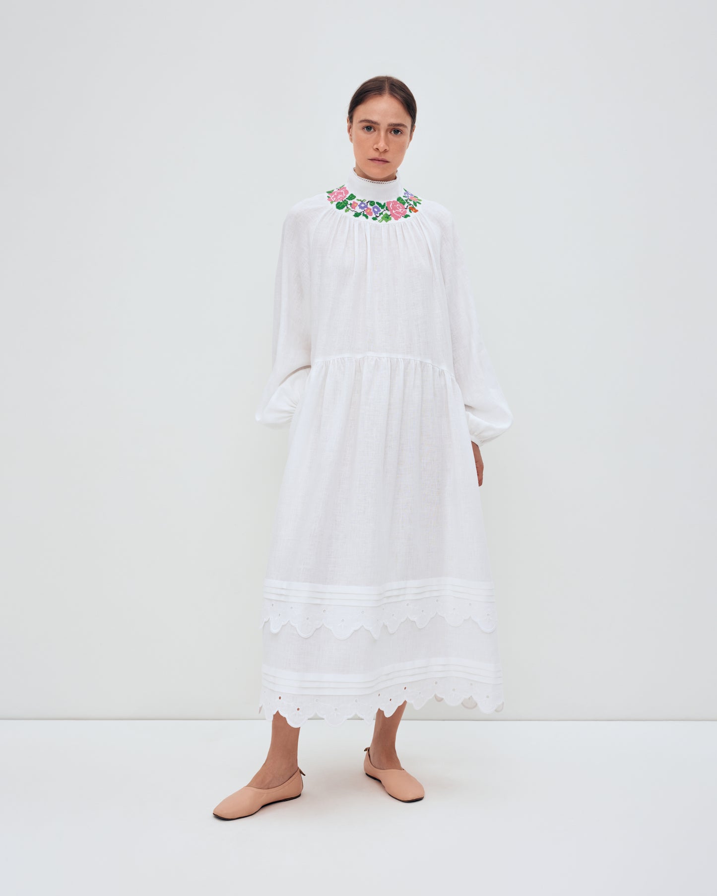 Купіть виріб ручної роботи Long embroidered dress with fastening "Vinok" від Nadiia World. Ідеальний вибір для додавання вишуканості та шарму до вашого житлового простору або колекції особистих аксесуарів.