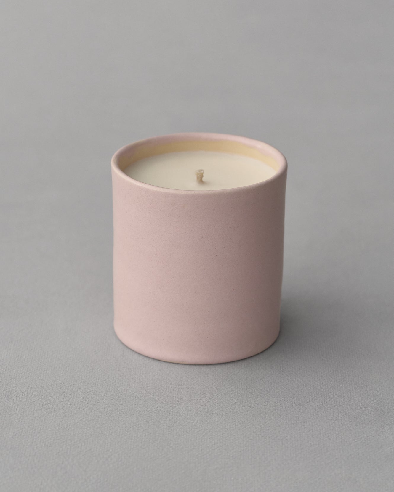 Scented candle in a ceramic cup "Someone Loves Someone"