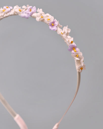 Купіть виріб ручної роботи Flower hairband "Tsarivna" in “Lilac” від Nadiia World. Ідеальний вибір для додавання вишуканості та шарму до вашого житлового простору або колекції особистих аксесуарів.