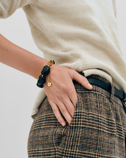 Купіть виріб ручної роботи Black "Beans" Bracelet від Nadiia World. Ідеальний вибір для додавання вишуканості та шарму до вашого житлового простору або колекції особистих аксесуарів.