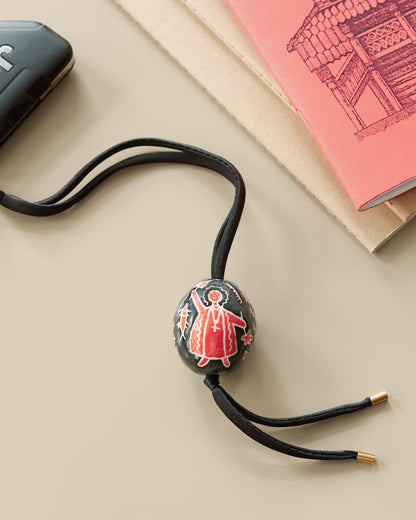 Купіть виріб ручної роботи Bag charm “Black and Red Pysanka” від Nadiia World. Ідеальний вибір для додавання вишуканості та шарму до вашого житлового простору або колекції особистих аксесуарів.