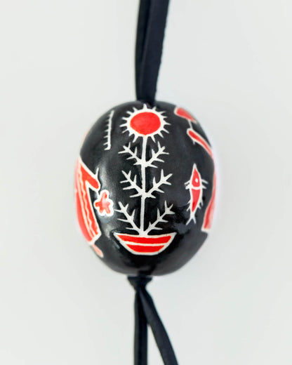 Купіть виріб ручної роботи Bag charm “Black and Red Pysanka” від Nadiia World. Ідеальний вибір для додавання вишуканості та шарму до вашого житлового простору або колекції особистих аксесуарів.