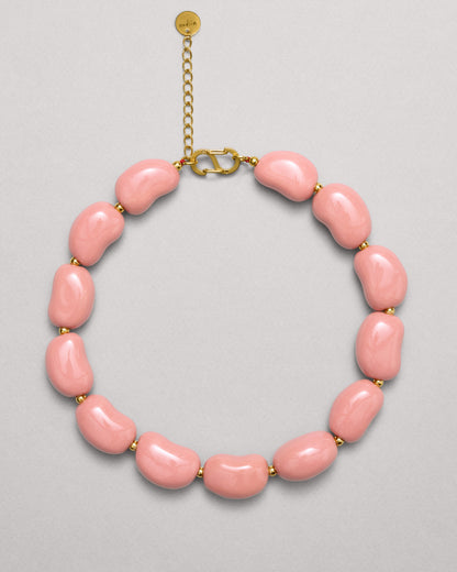 Купіть виріб ручної роботи Pink "Beans" Necklace від Nadiia World. Ідеальний вибір для додавання вишуканості та шарму до вашого житлового простору або колекції особистих аксесуарів.